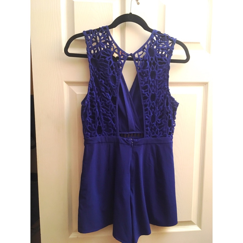 Blue romper with beautiful detailed open back
